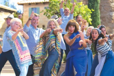 (L to R, center) Rosie (JULIE WALTERS), Sam (PIERCE BROSNAN), Sophie (AMANDA SEYFRIED) and Tanya (CHRISTINE BARANSKI) in "Mamma Mia! Here We Go Again." Ten years after "Mamma Mia! The Movie," you are invited to return to the magical Greek island of Kalokairi in an all-new original musical based on the songs of ABBA.